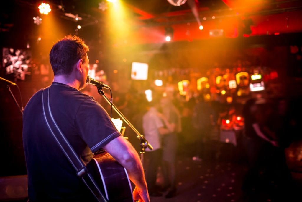 musician plays a guitar